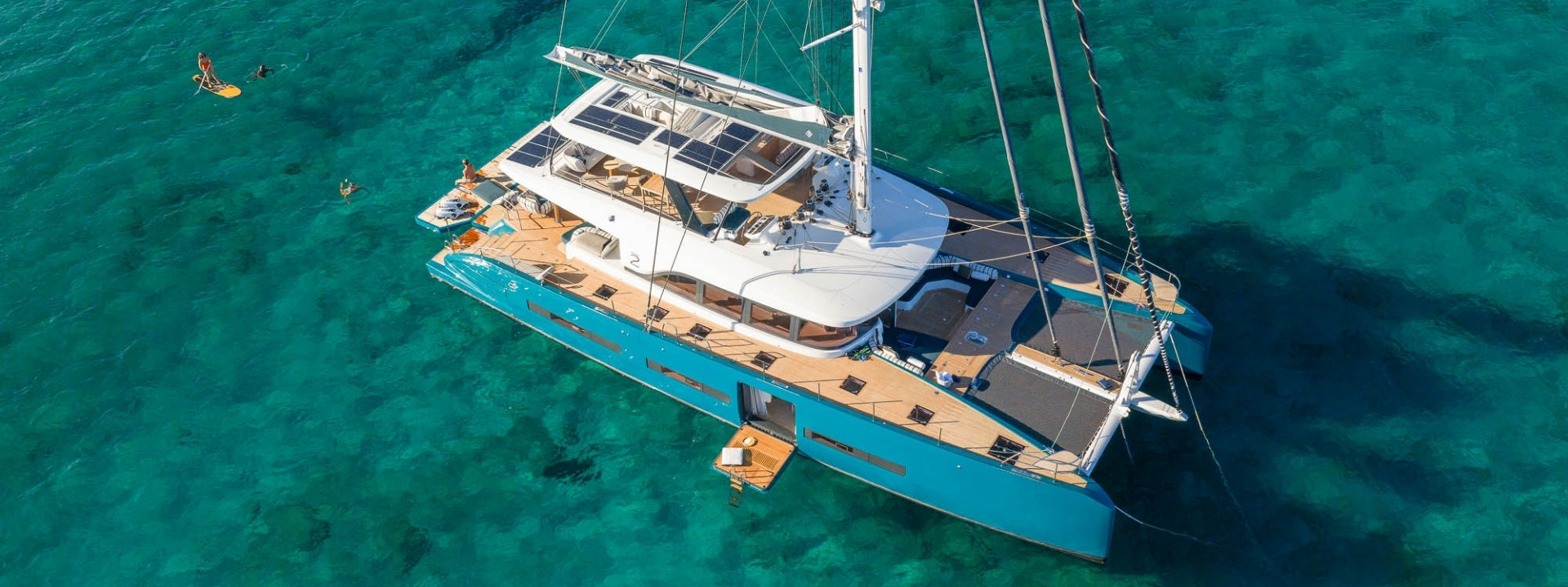 Aerial view of the Lagoon EIGHTY 2 catamaran at anchor in calm turquoise water